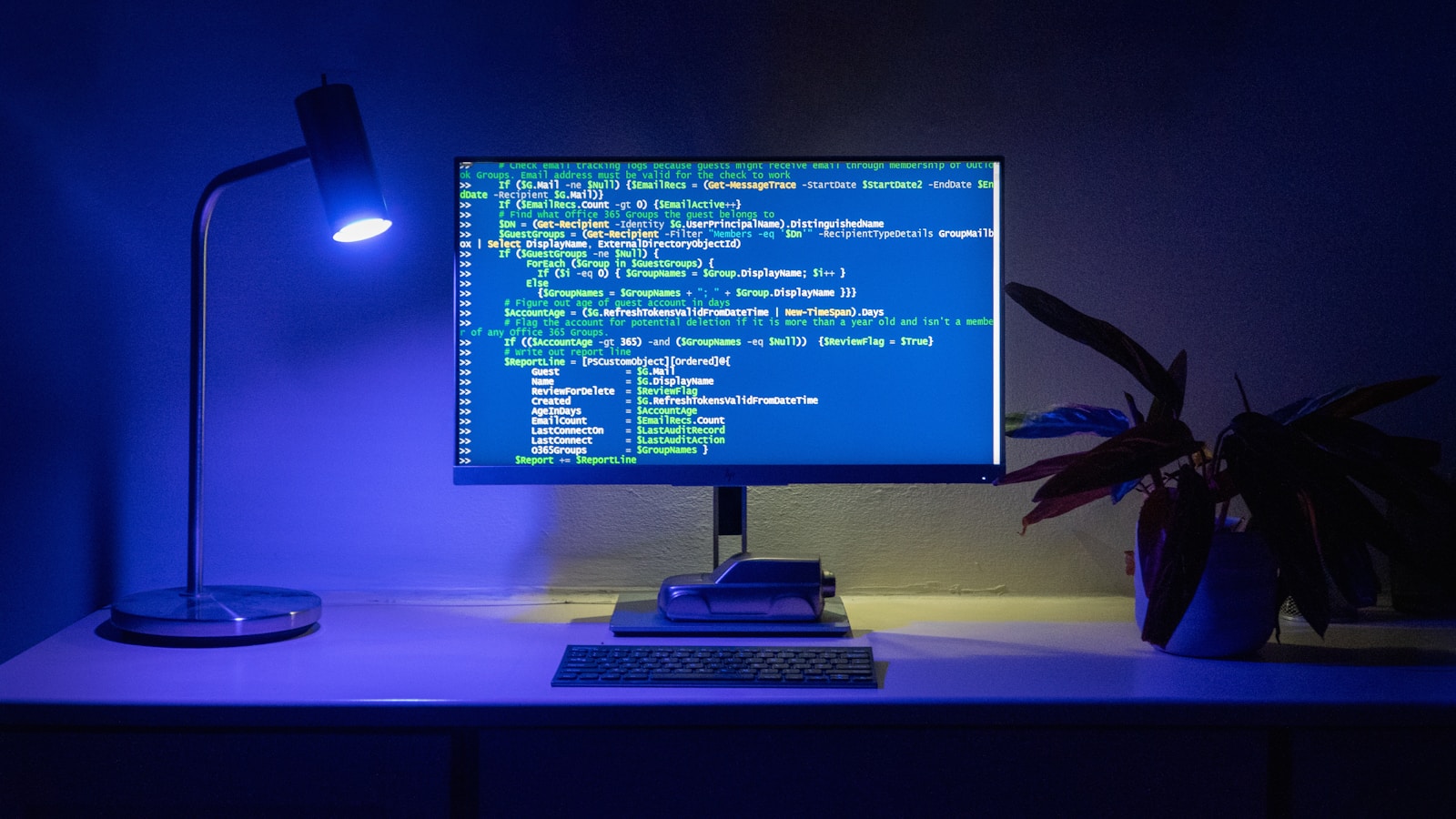 Developer workspace with code and security dashboard on a laptop