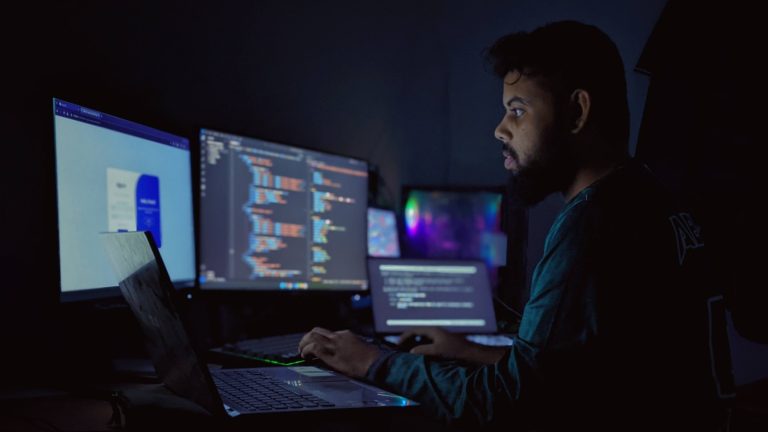 Developer workspace with code, workflow diagrams, and compliance notes