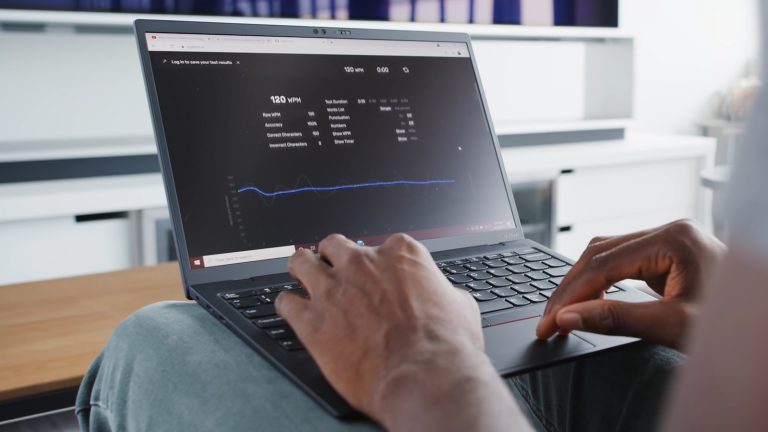 Premium workspace showing a laptop and automation dashboard