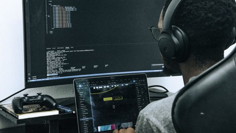 Developer workspace with code on laptop